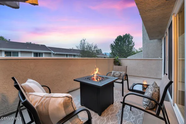 a terrace of a house with outdoor seating