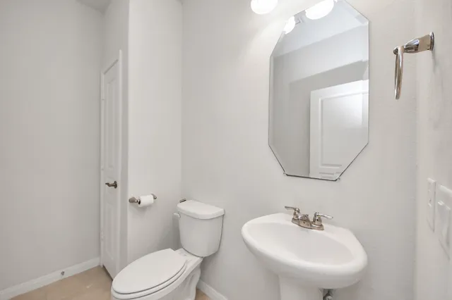 a large kitchen with stainless steel appliances kitchen island granite countertop a stove a refrigerator a sink a island and chairs