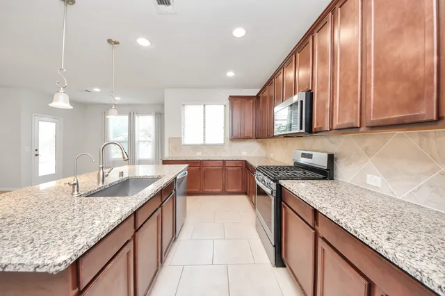 a view of a backyard with plants and a garden