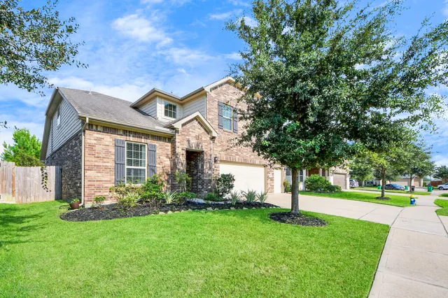 a view of a hallway with a white walls and stairs