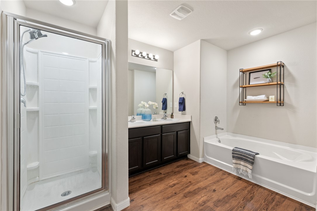2018 Eagle View Drive Navasota, TX 77868 - Photo 16 of 28 a bathroom with a bathtub shower sink and mirror