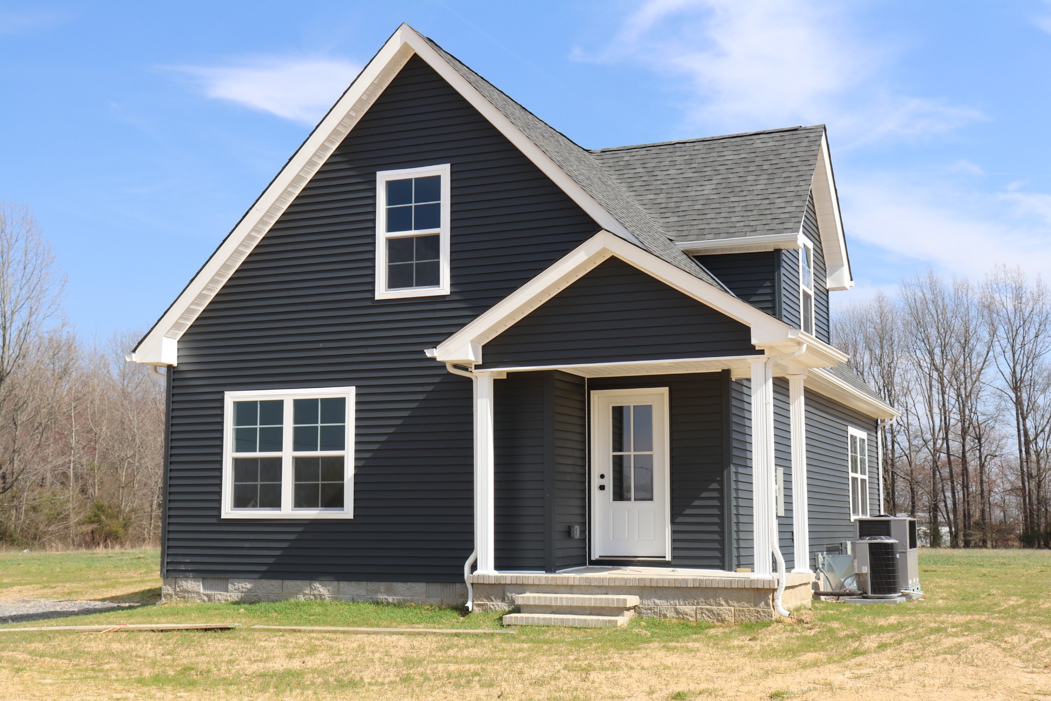 160 Garrett Road Lafayette, TN 37083 - Photo 1 of 18 a front view of a house with a yard