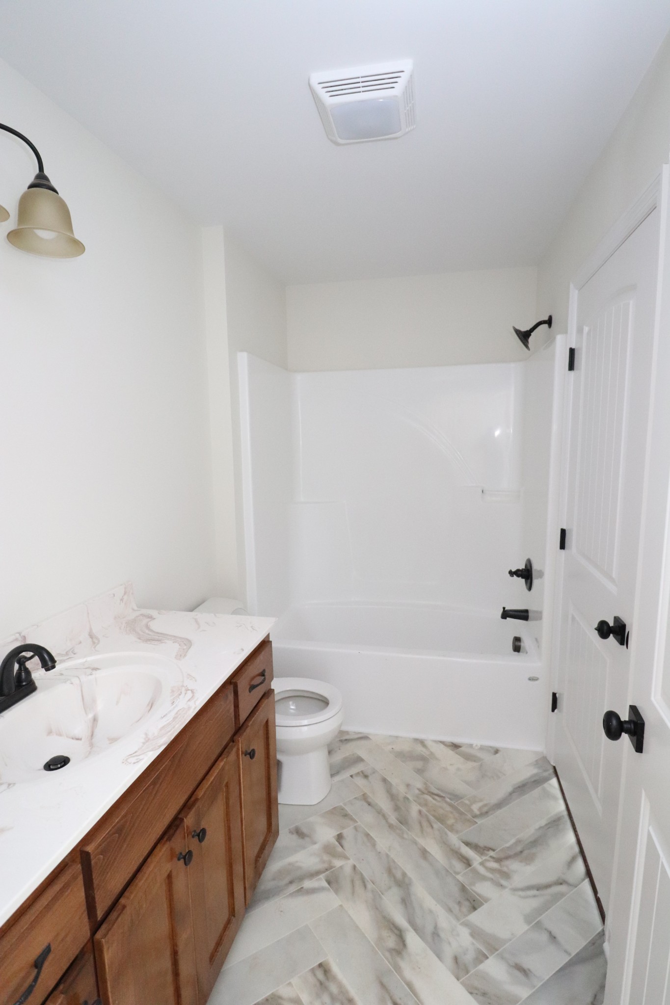 160 Garrett Road Lafayette, TN 37083 - Photo 16 of 18 a bathroom with a sink a toilet and shower