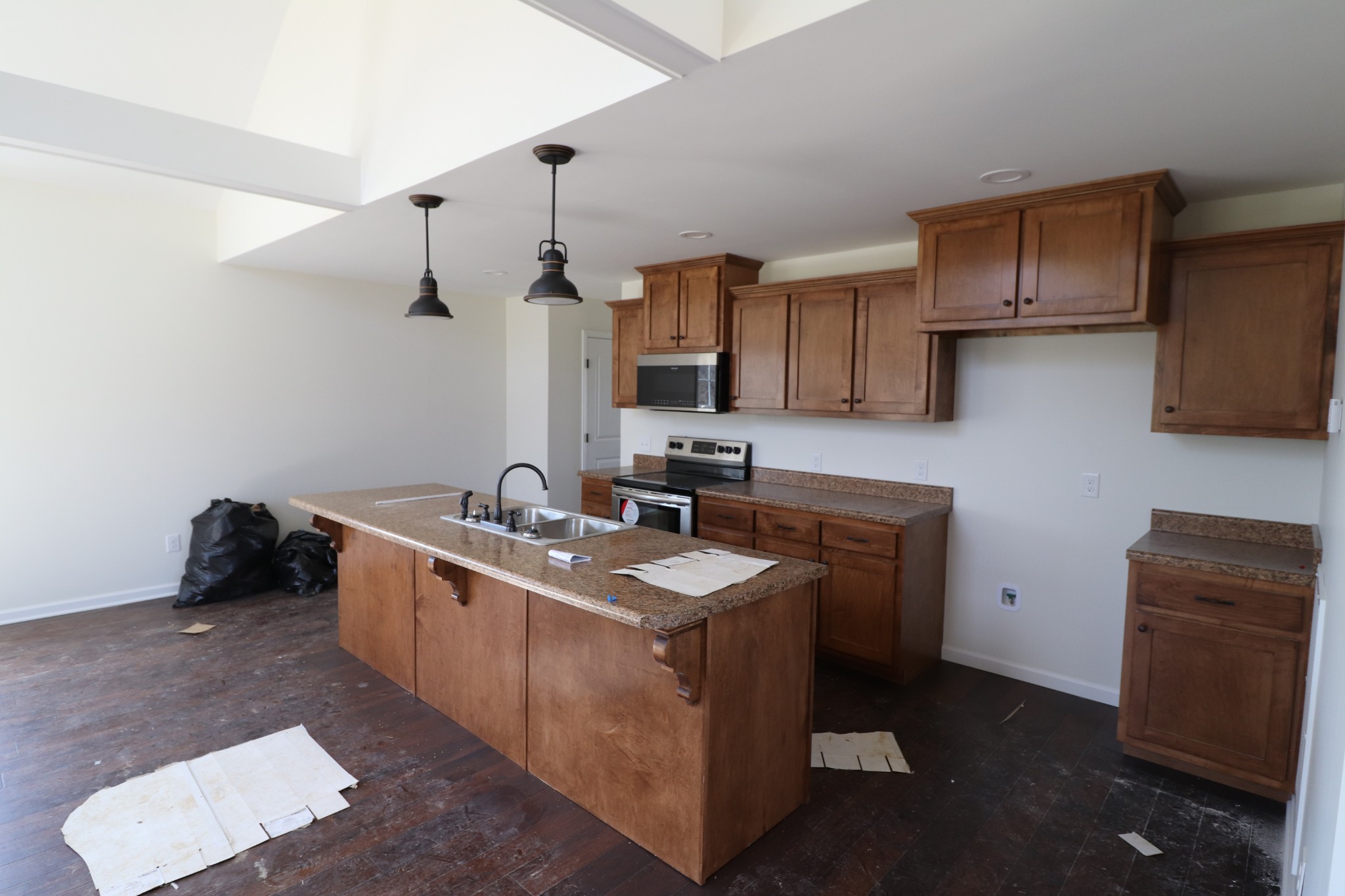 160 Garrett Road Lafayette, TN 37083 - Photo 8 of 18 a kitchen with a sink stove and cabinets