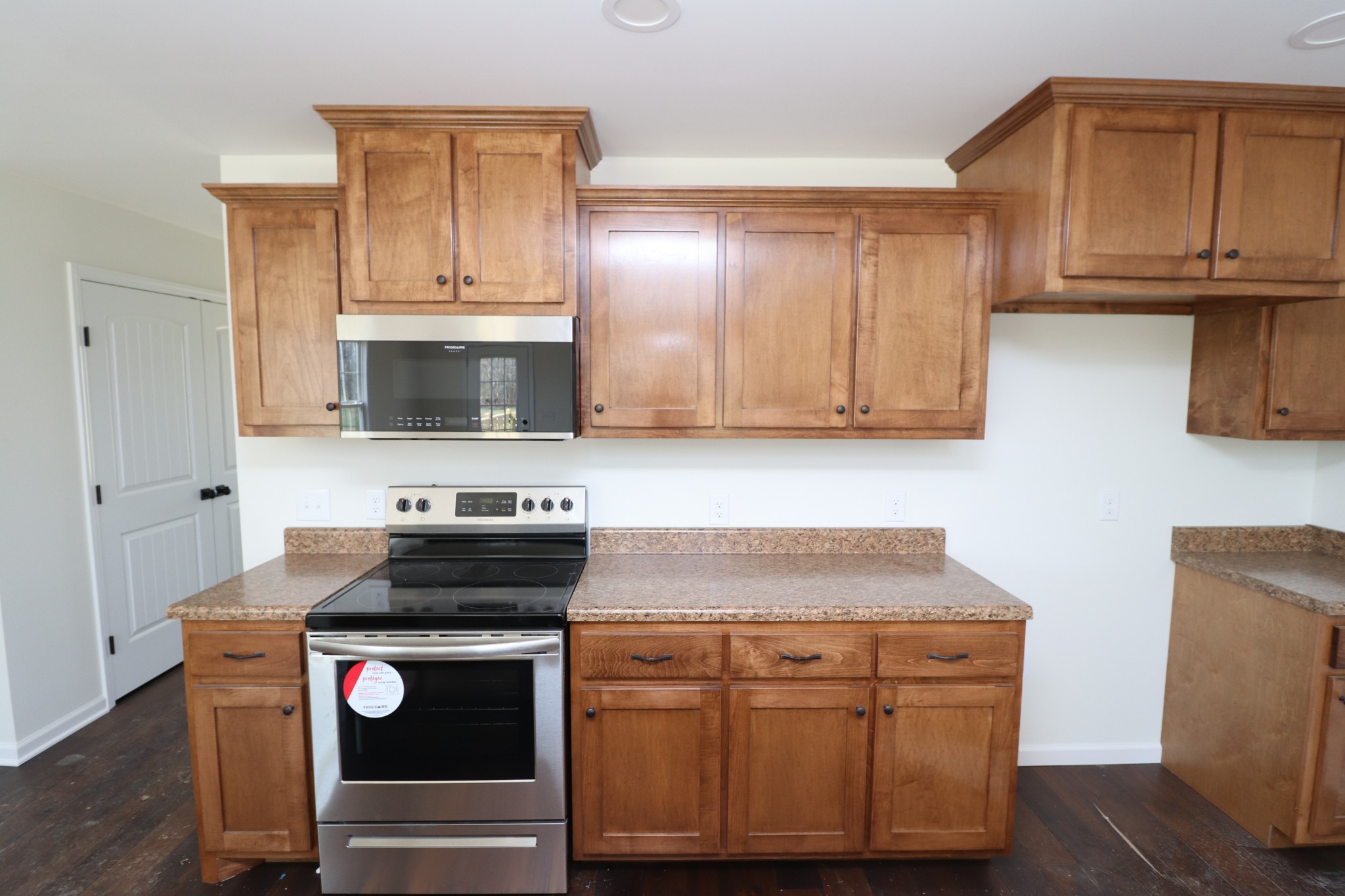 160 Garrett Road Lafayette, TN 37083 - Photo 9 of 18 a kitchen with stainless steel appliances granite countertop a sink stove and microwave