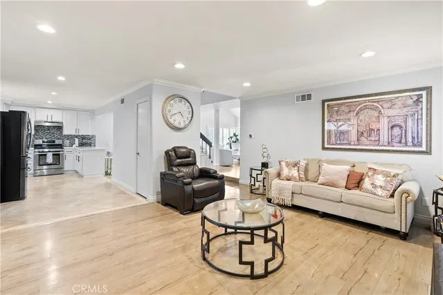 a living room with furniture and a clock