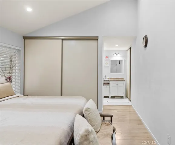 a bedroom with a bed and a view of bathroom