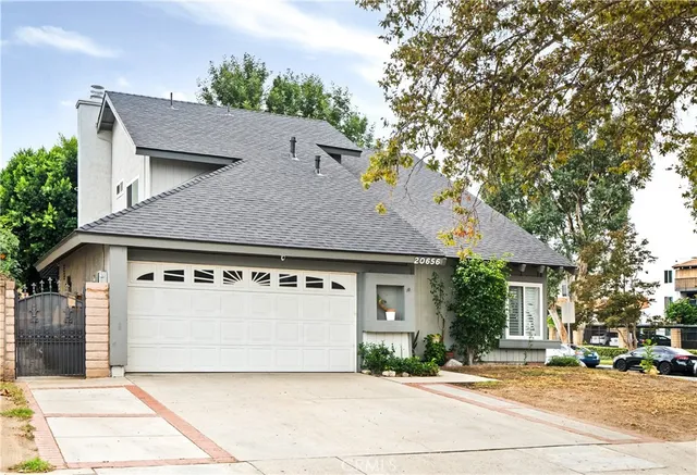 a house with a tree in front of it