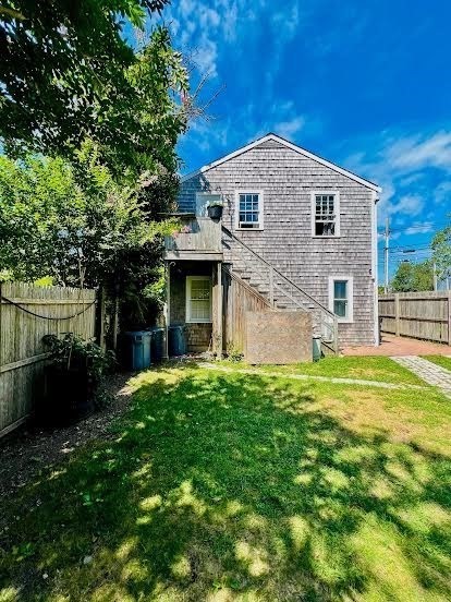 48 Edgartown - West Tisbury Road Edgartown, MA 02539 - Photo 2 of 9 a front view of a house with a garden