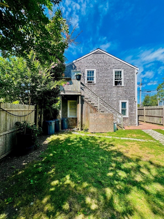 48 Edgartown - West Tisbury Road Edgartown, MA 02539 - Photo 4 of 9 a front view of a house with a yard