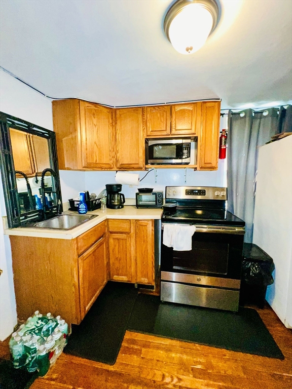 48 Edgartown - West Tisbury Road Edgartown, MA 02539 - Photo 7 of 9 a kitchen with stainless steel appliances granite countertop a stove a sink and a refrigerator