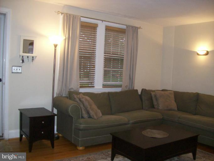 8 Murdock Road Baltimore, MD 21212 - Photo 2 of 24 a living room with furniture and a window