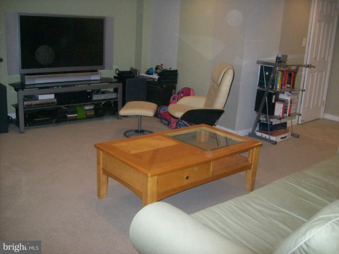 8 Murdock Road Baltimore, MD 21212 - Photo 11 of 24 a living room with furniture and a flat screen tv