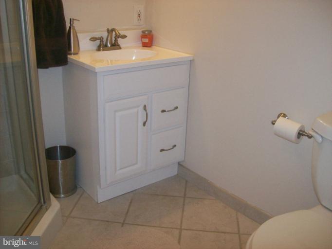 8 Murdock Road Baltimore, MD 21212 - Photo 12 of 24 a bathroom with a sink toilet and shower