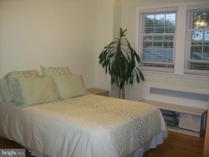 8 Murdock Road Baltimore, MD 21212 - Photo 19 of 24 a bed sitting in a bedroom next to a window
