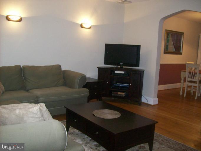 8 Murdock Road Baltimore, MD 21212 - Photo 20 of 24 a living room with furniture and a flat screen tv
