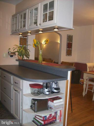 8 Murdock Road Baltimore, MD 21212 - Photo 22 of 24 a view of storage and utility room with wooden floor