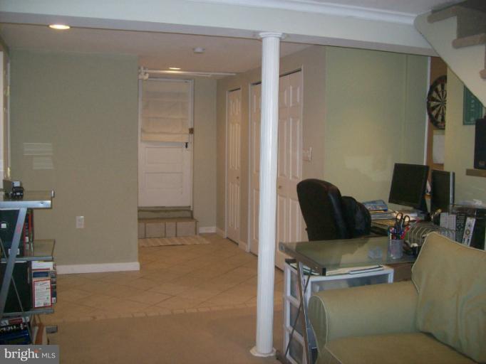 8 Murdock Road Baltimore, MD 21212 - Photo 23 of 24 a living room with furniture a flat screen tv and a window