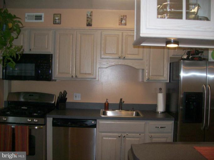 8 Murdock Road Baltimore, MD 21212 - Photo 4 of 24 a kitchen with a sink and cabinets