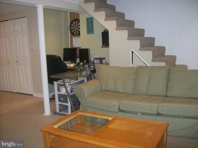 8 Murdock Road Baltimore, MD 21212 - Photo 5 of 24 a living room with furniture a fireplace and a flat screen tv