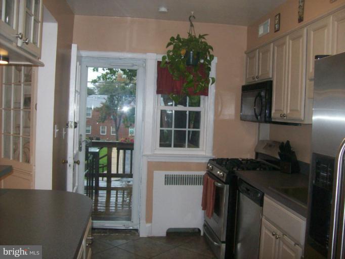 8 Murdock Road Baltimore, MD 21212 - Photo 10 of 24 a kitchen with stainless steel appliances granite countertop a refrigerator and a sink