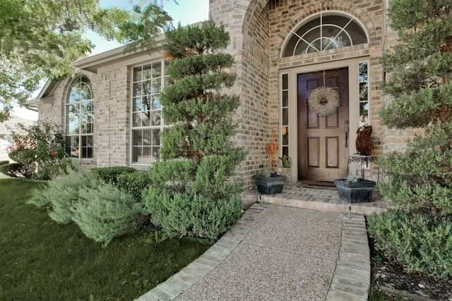 front view of a house with a small yard