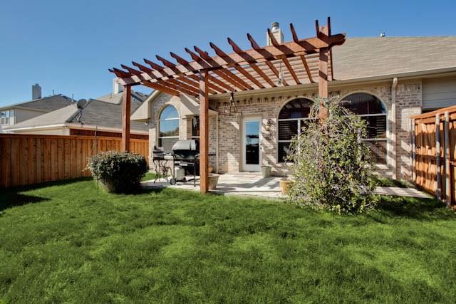 6352 Rolling Hill Road The Colony, TX 75056 - Photo 23 of 23 front view of a house with a big yard