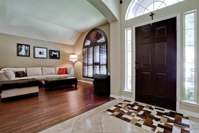 a bedroom with furniture and a window