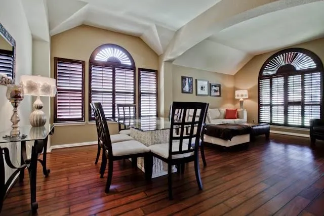 a view of a livingroom with furniture window and wooden floor