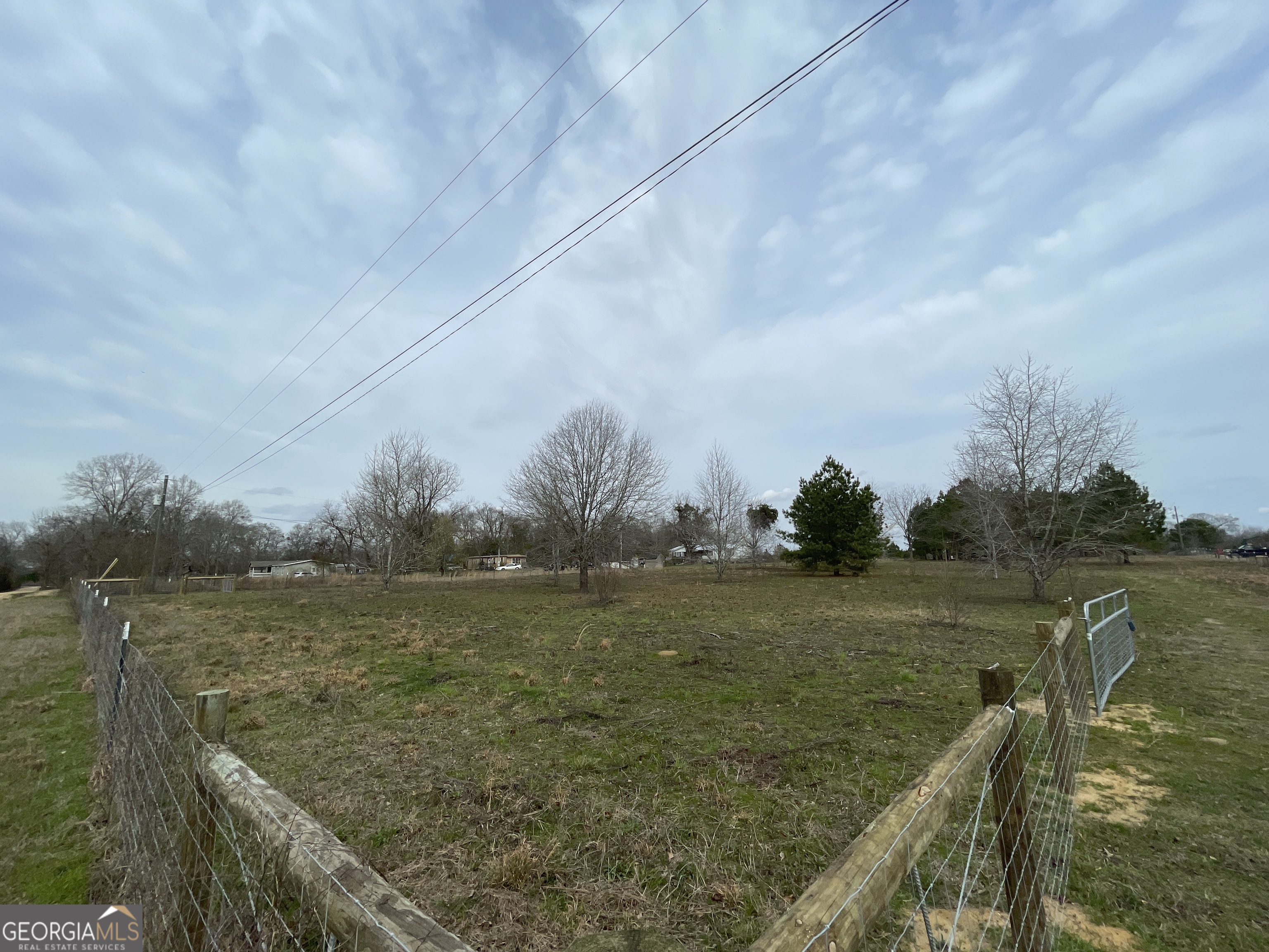 141 James English Road Cochran, GA 31014 - Photo 2 of 7 a view of a lake with a yard