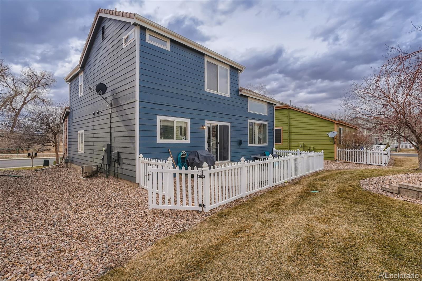 13890 Madison Street Thornton, CO 80602 - Photo 11 of 11 a front view of a house with a yard