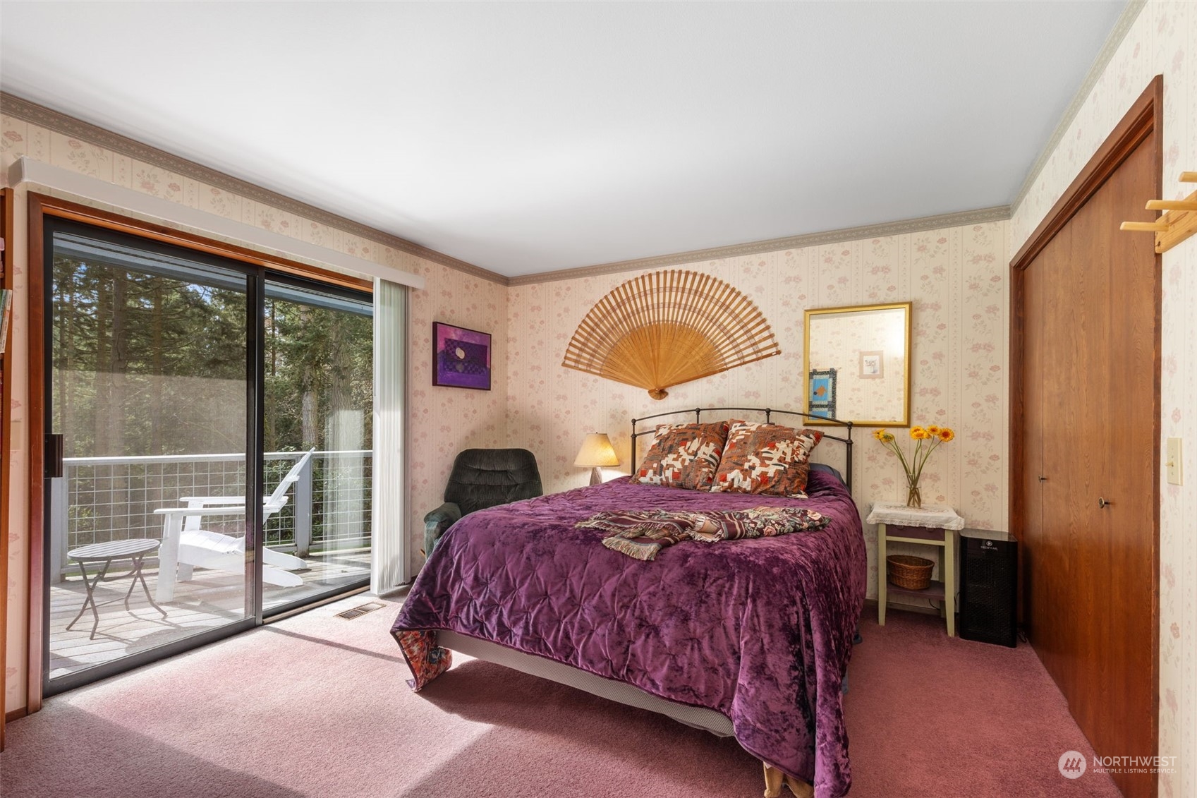 280 Cline Road Sequim, WA 98382 - Photo 20 of 32 a bedroom with a bed and a large window