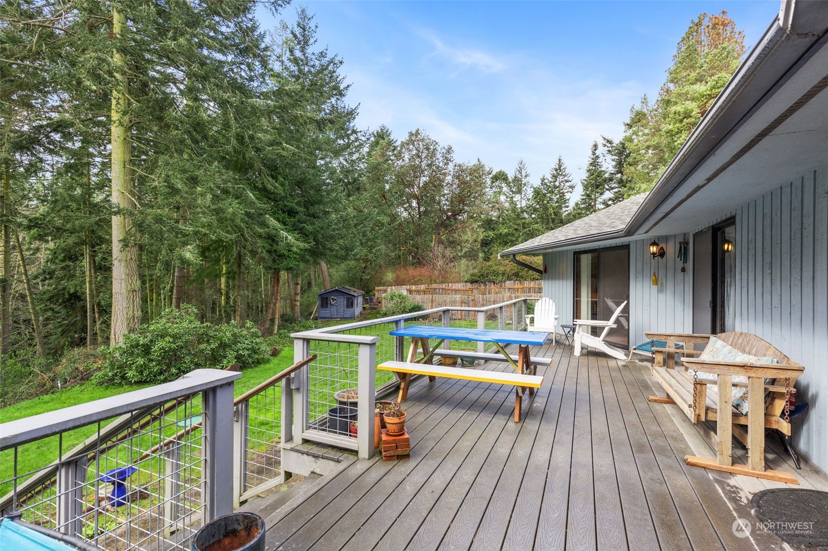 280 Cline Road Sequim, WA 98382 - Photo 23 of 32 a view of house with deck and outdoor seating