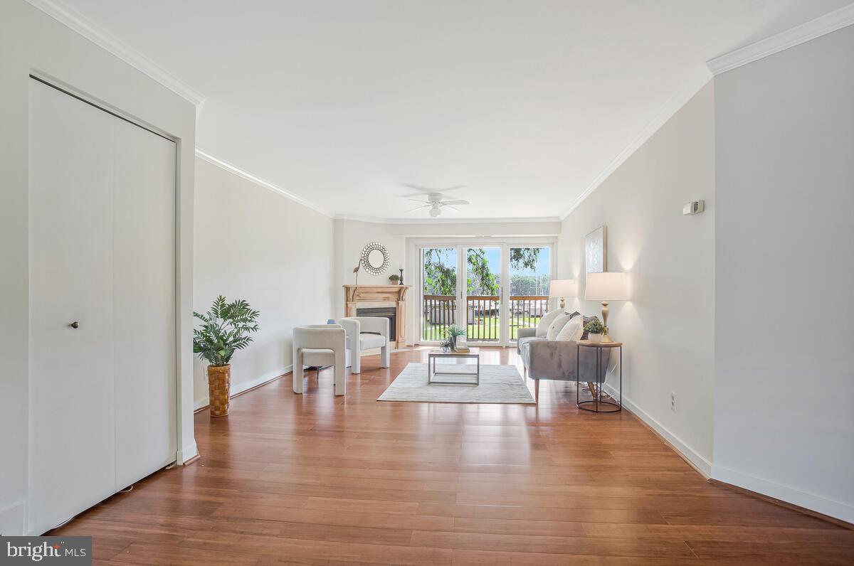 7002 Channel Village Court, Unit 101 Annapolis, MD 21403 - Photo 7 of 48 a living room with furniture and a large window