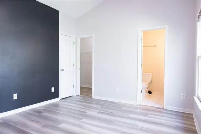 a view of a room with wooden floor