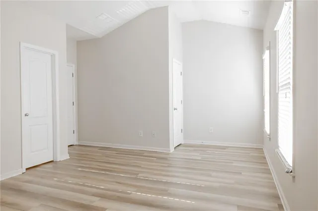 a view of room with wooden floor