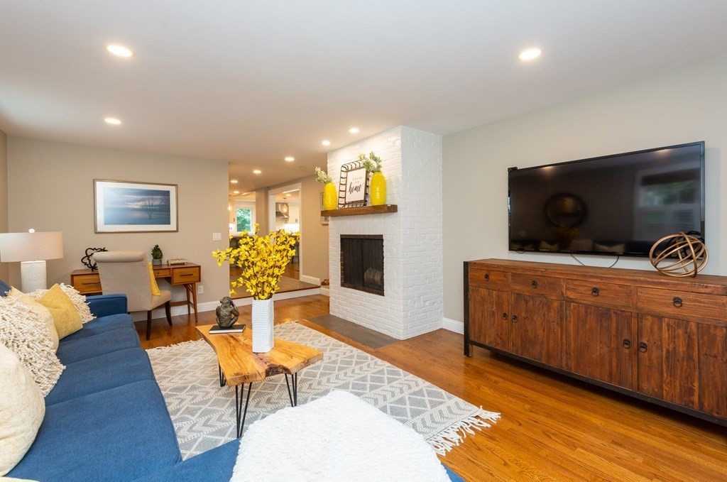 12 Moran Road Lynnfield, MA 01940 - Photo 22 of 42 a living room with furniture and a flat screen tv