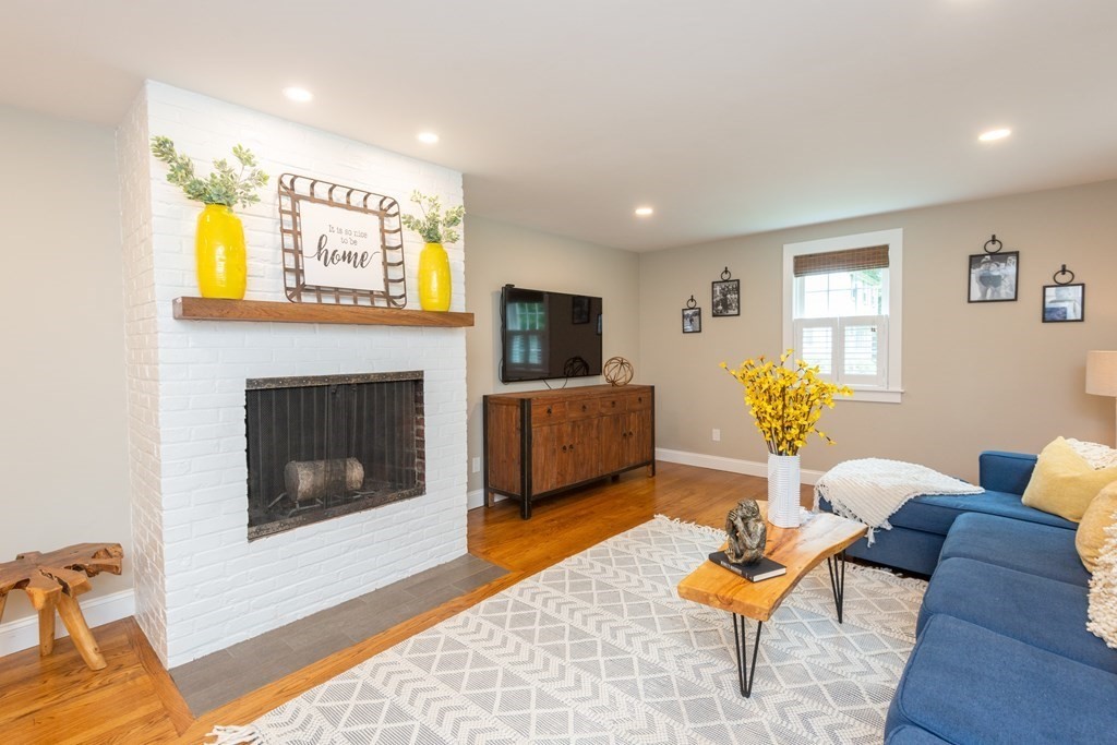 12 Moran Road Lynnfield, MA 01940 - Photo 23 of 42 a living room with furniture and a fireplace