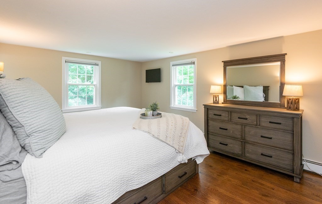 12 Moran Road Lynnfield, MA 01940 - Photo 25 of 42 a bedroom with a bed and a dresser