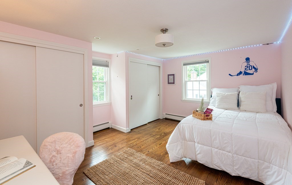 12 Moran Road Lynnfield, MA 01940 - Photo 30 of 42 a bedroom with a bed and wooden floor