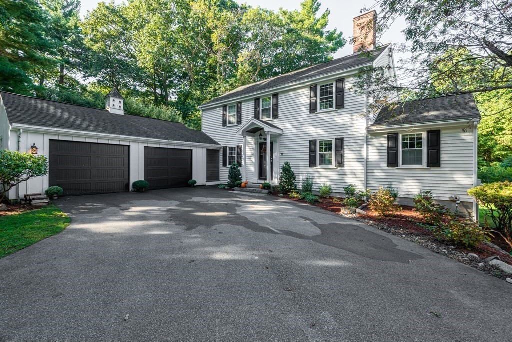 12 Moran Road Lynnfield, MA 01940 - Photo 3 of 42 a front view of a house with a yard and a garage