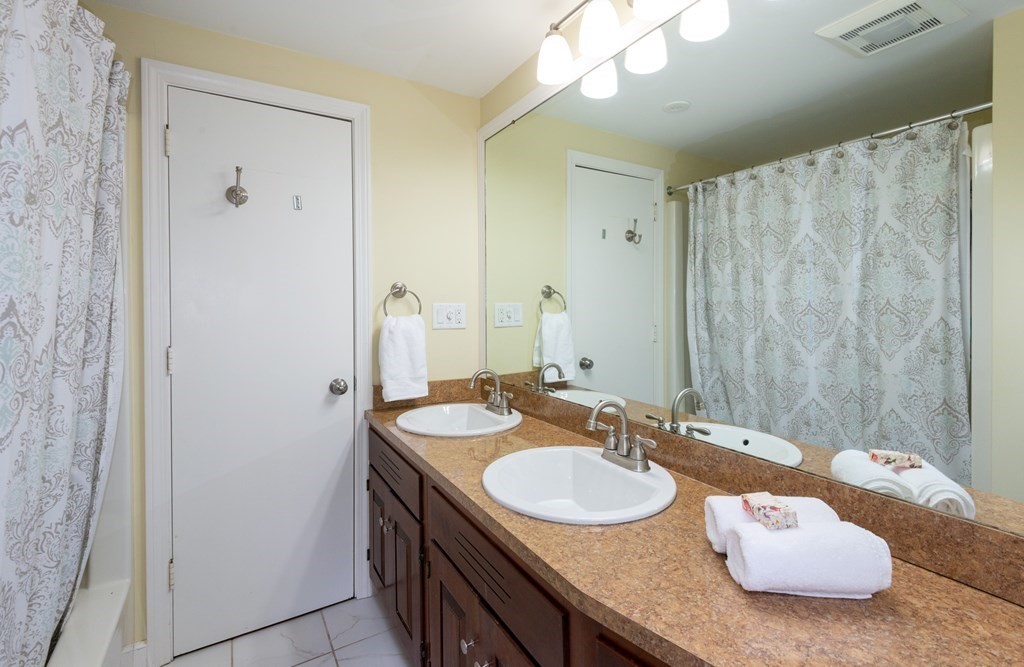 12 Moran Road Lynnfield, MA 01940 - Photo 33 of 42 a bathroom with a granite countertop sink and a mirror