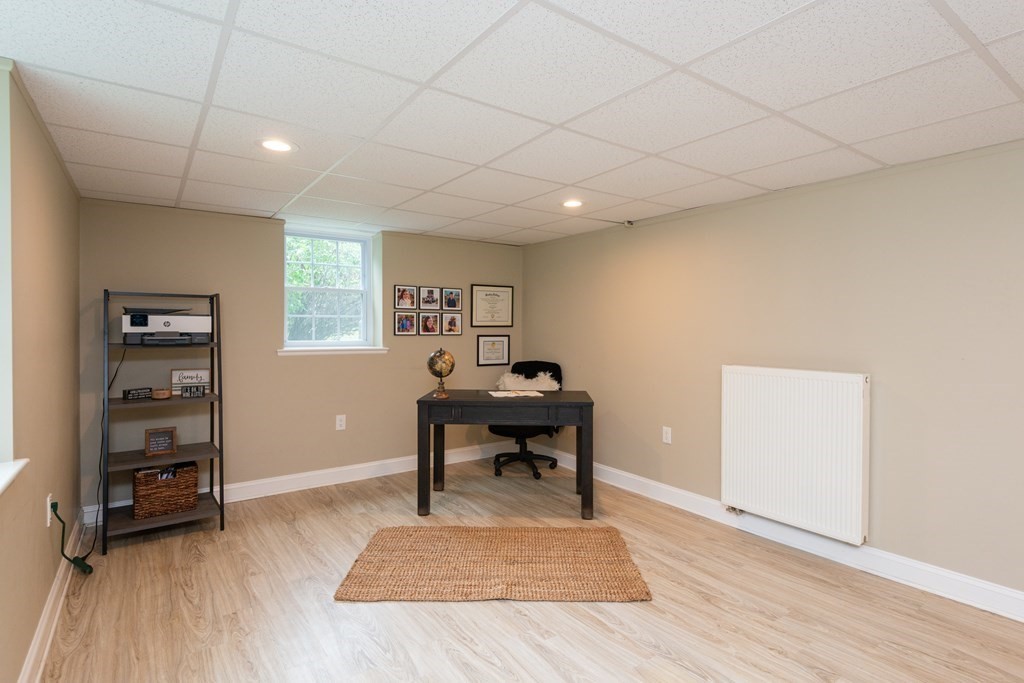 12 Moran Road Lynnfield, MA 01940 - Photo 36 of 42 a living room with furniture and a wooden floor