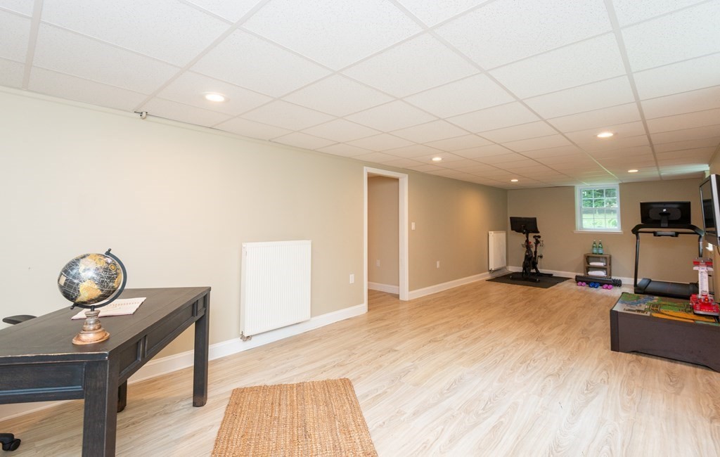 12 Moran Road Lynnfield, MA 01940 - Photo 37 of 42 a view of a livingroom with furniture and a flat screen tv