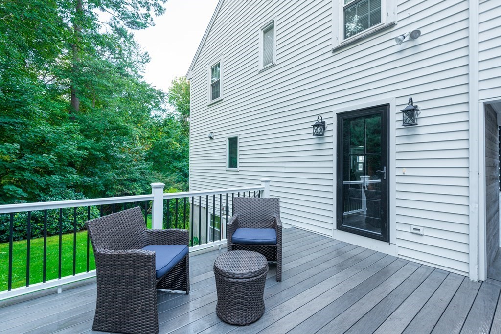 12 Moran Road Lynnfield, MA 01940 - Photo 39 of 42 a view of a chair and table in the balcony