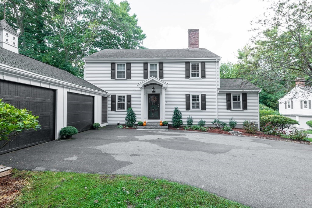 12 Moran Road Lynnfield, MA 01940 - Photo 4 of 42 a front view of a house with yard and parking