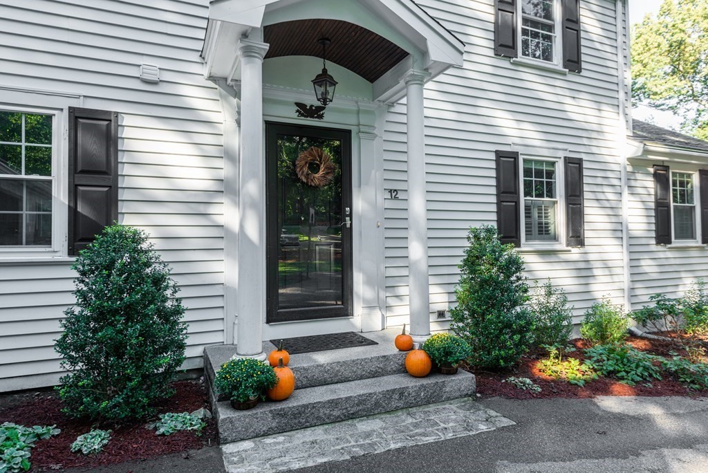 12 Moran Road Lynnfield, MA 01940 - Photo 5 of 42 a view of a house with sitting area and potted plants