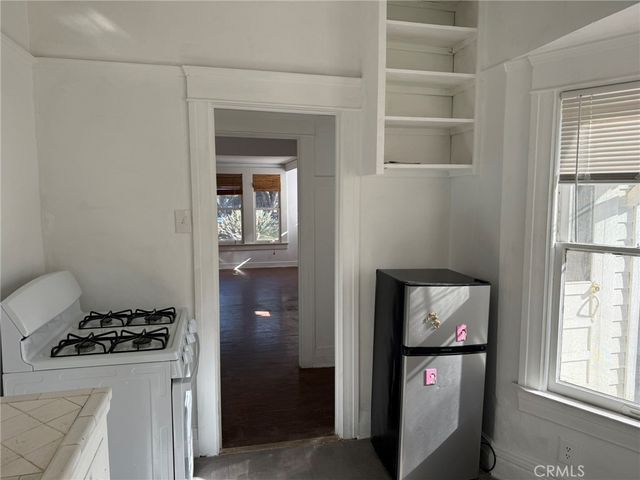 a kitchen with a stove and a refrigerator