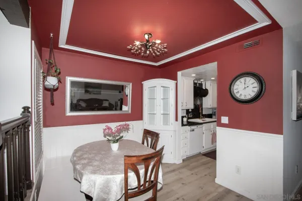 a kitchen with granite countertop a sink and a stove top oven
