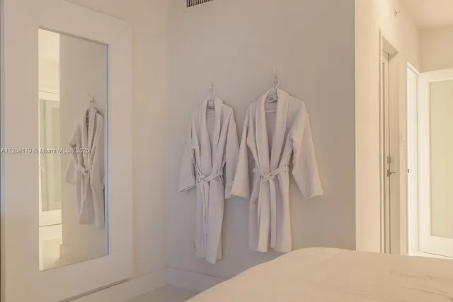 a bathroom with a toilet a sink and shower